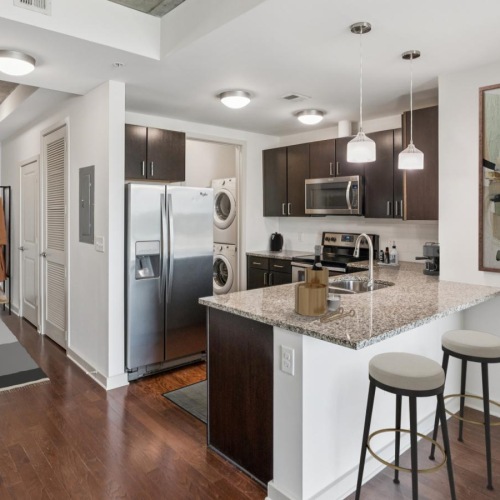 a kitchen with a bar stool