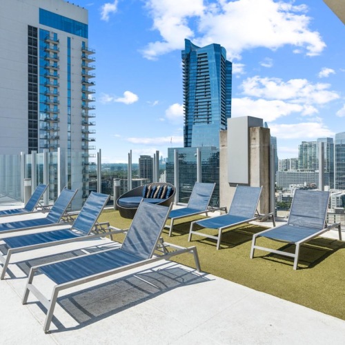 a group of chairs and tables outside