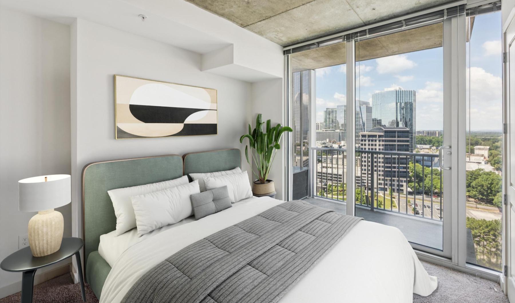 a bedroom with a large window