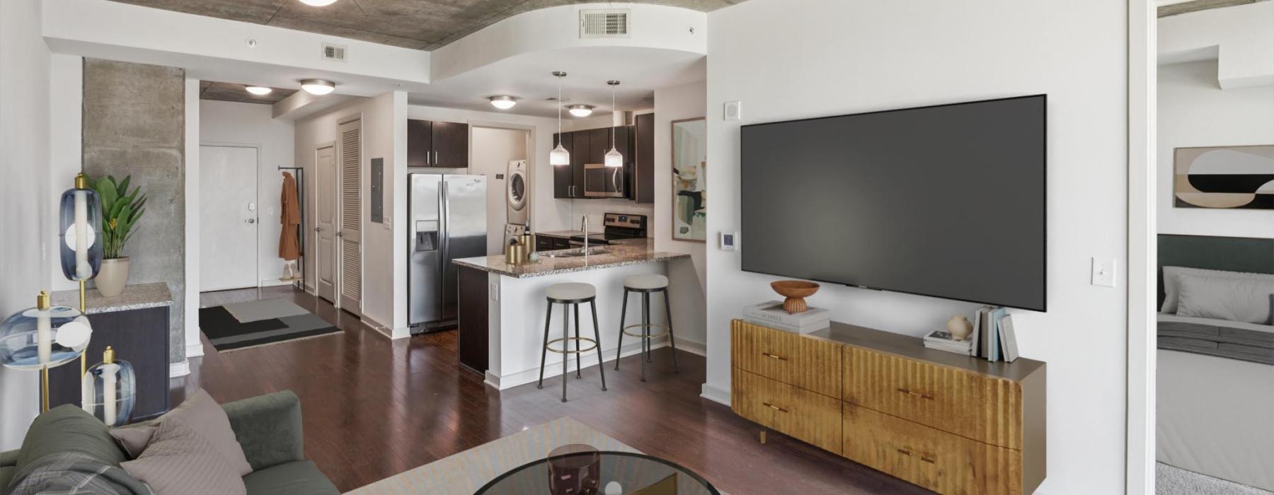 a living room with a tv and couches