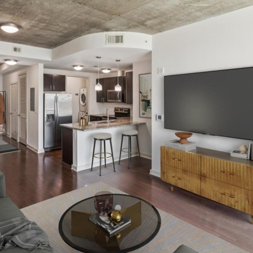 a living room with a tv and couches