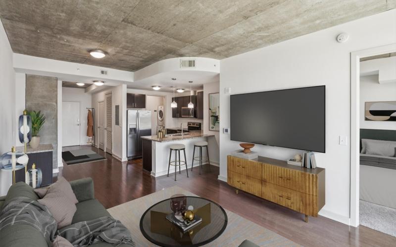 a living room with a tv and couches