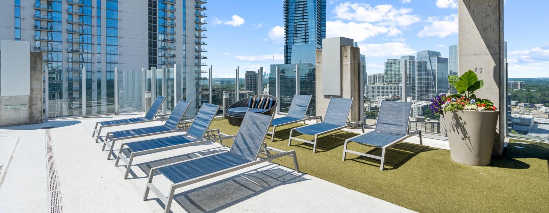 a group of chairs and tables outside